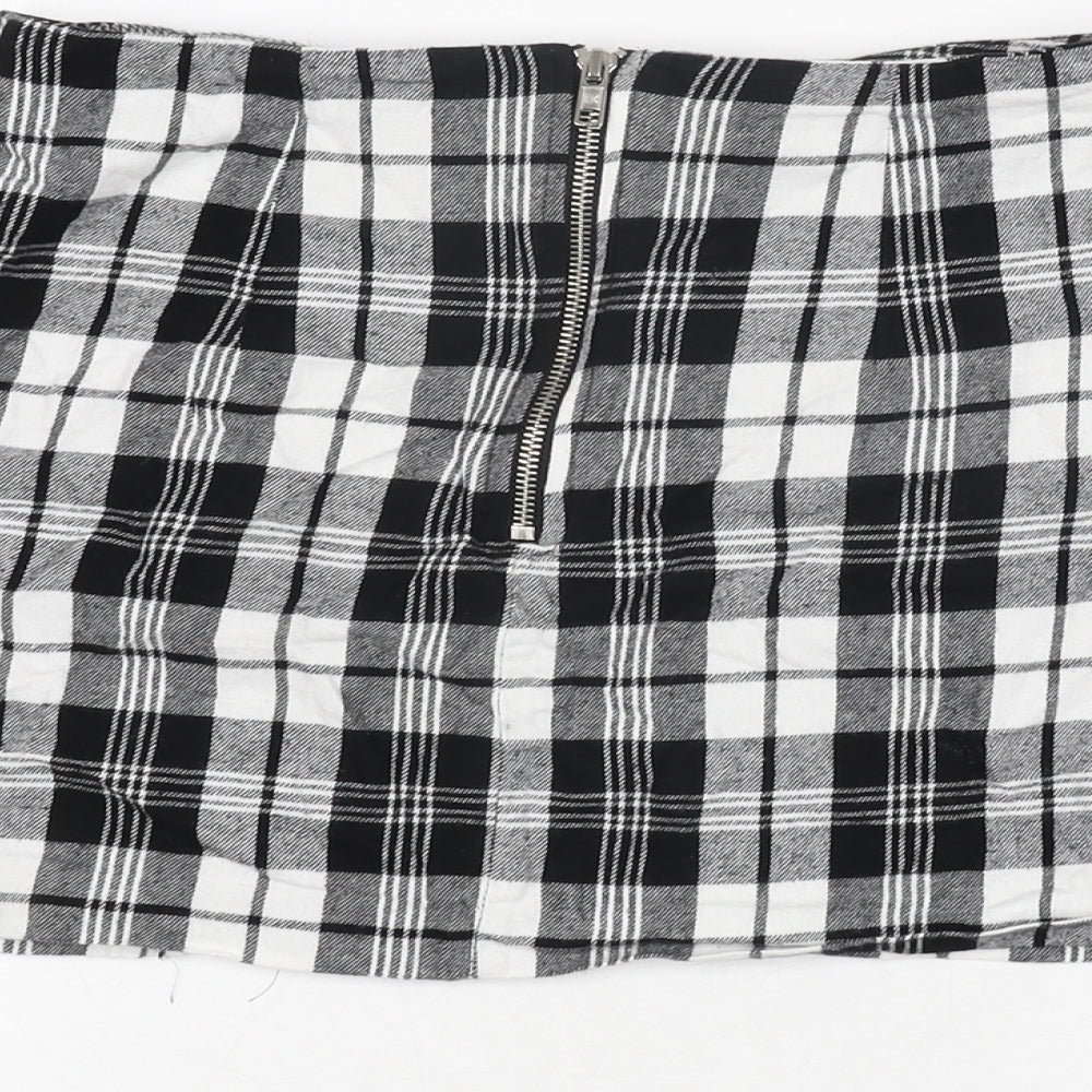 Brand and care label for ASOS women’s black plaid cotton mini skirt, size UK 8, zip