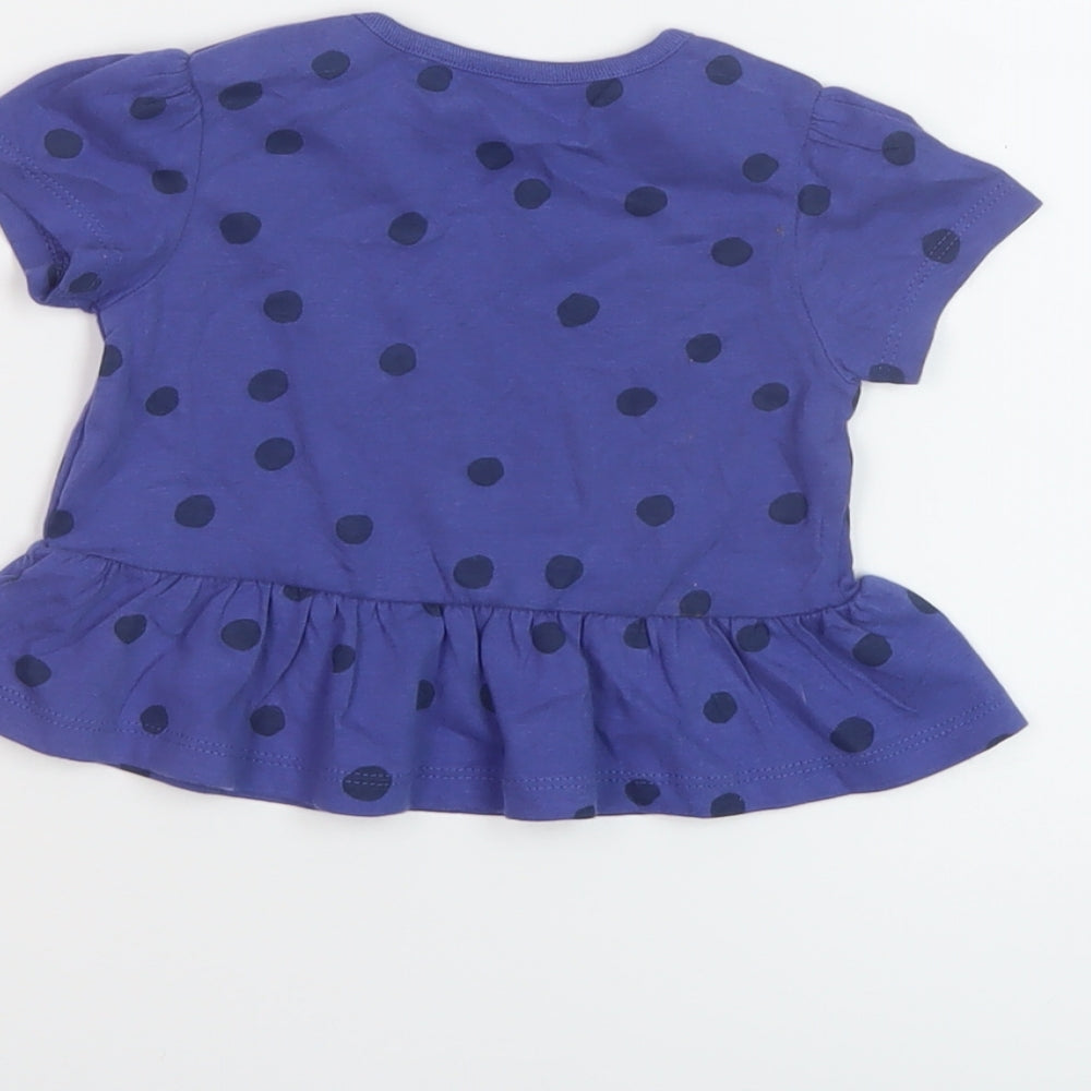 Brand and care label for Marks & Spencer girls’ black polka dot cotton basic t-shirt, size 6-9, months crew neck snap