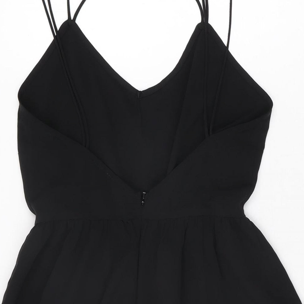 Brand and care label for ASOS women’s black polyester playsuit one-piece, size UK 4, 3-inch leg zip