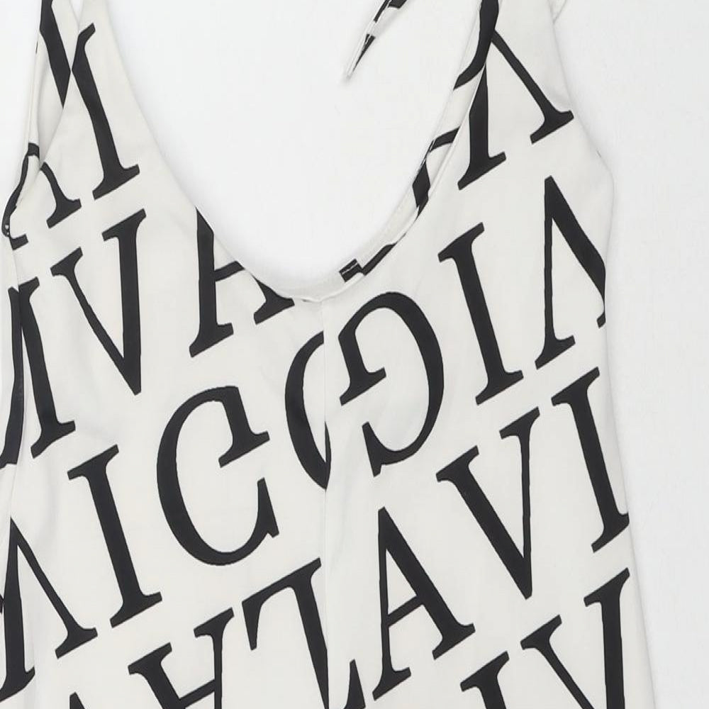 Brand and care label for I SAW IT FIRST women’s white geometric polyester mini, size M, round neck pullover - letters