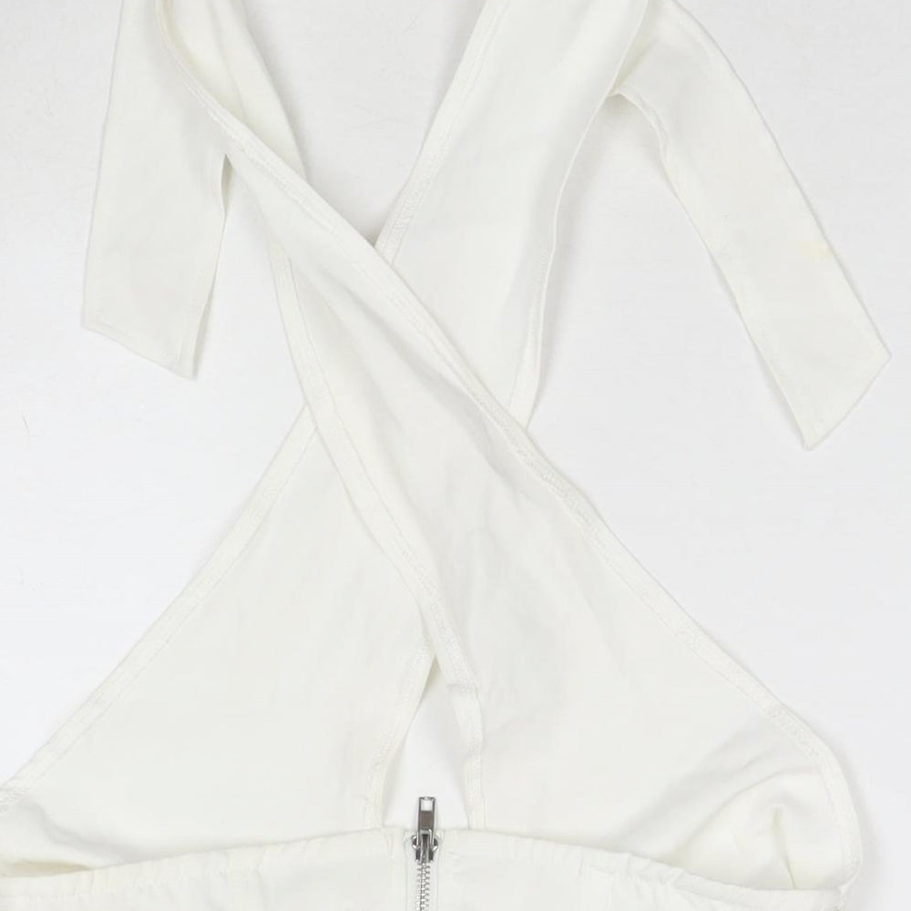 Brand and care label for Missguided women’s white polyester wrap tank, size UK 10, halter - cropped
