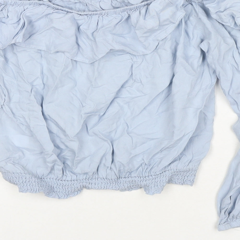 Brand and care label for H&M girls’ blue viscose basic t-shirt, size 11, years off the shoulder pullover
