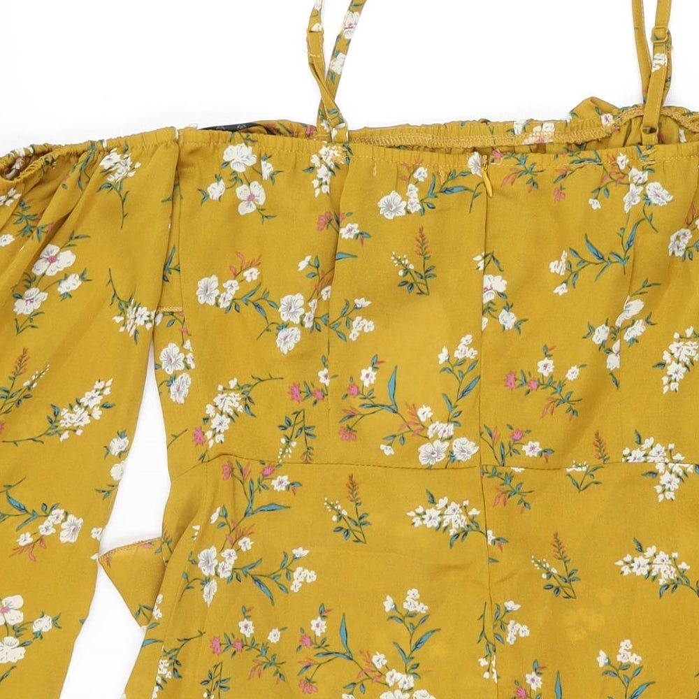 Brand and care label for Missguided women’s yellow floral polyester mini, size UK 10, square neck zip
