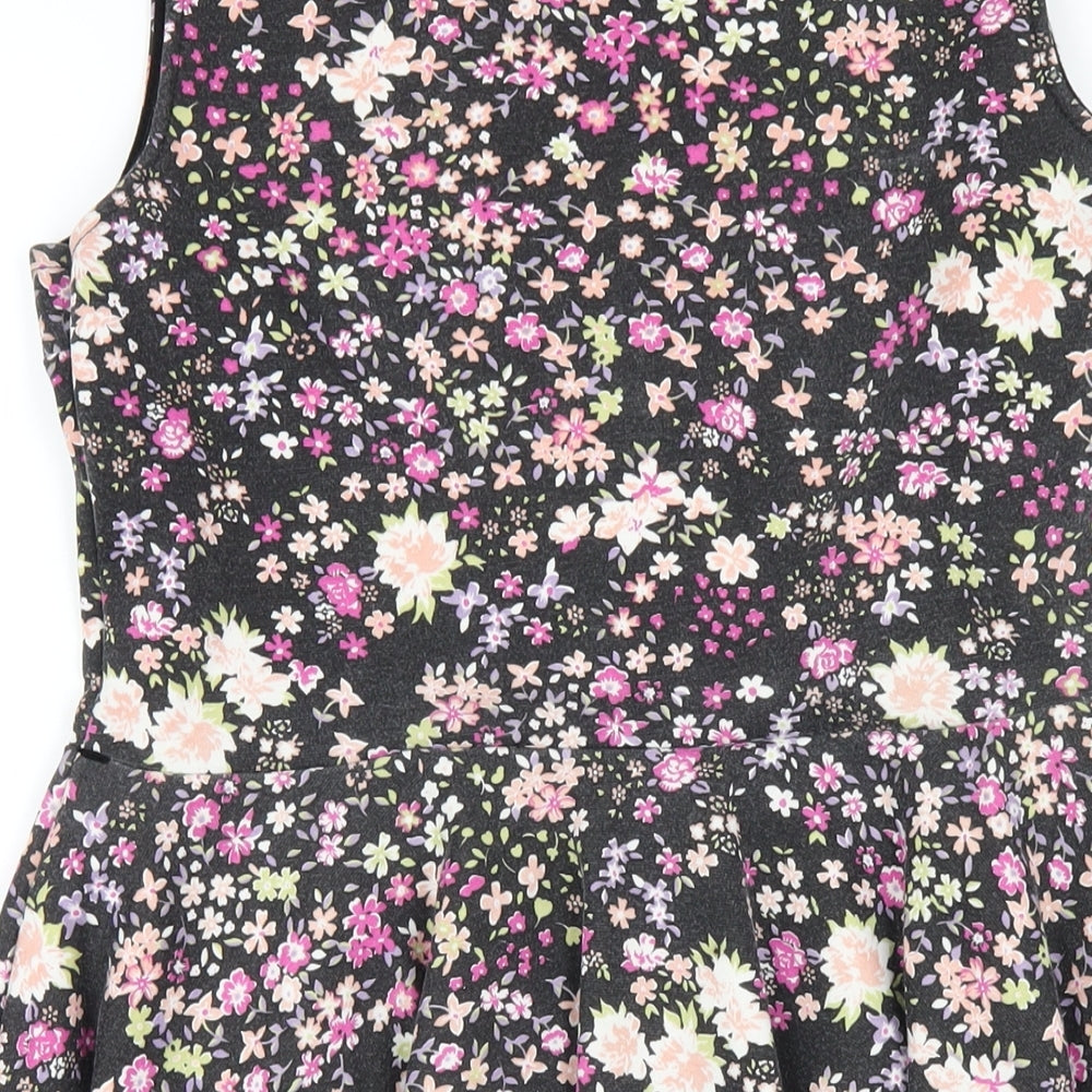 Brand and care label for Club L women’s black floral polyester a-line, size UK 14, round neck pullover