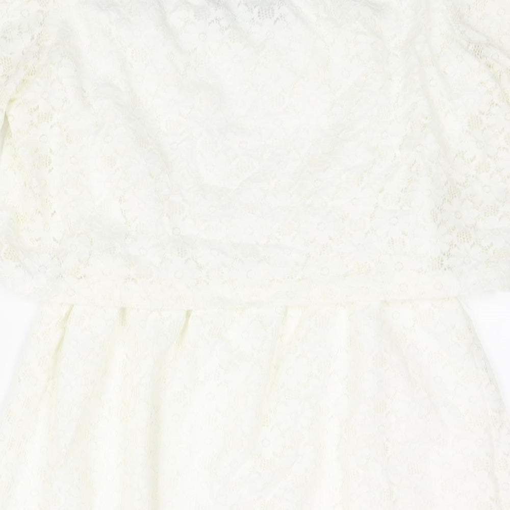 Brand and care label for Fashion Union women’s ivory nylon mini, size UK 10, boat neck pullover