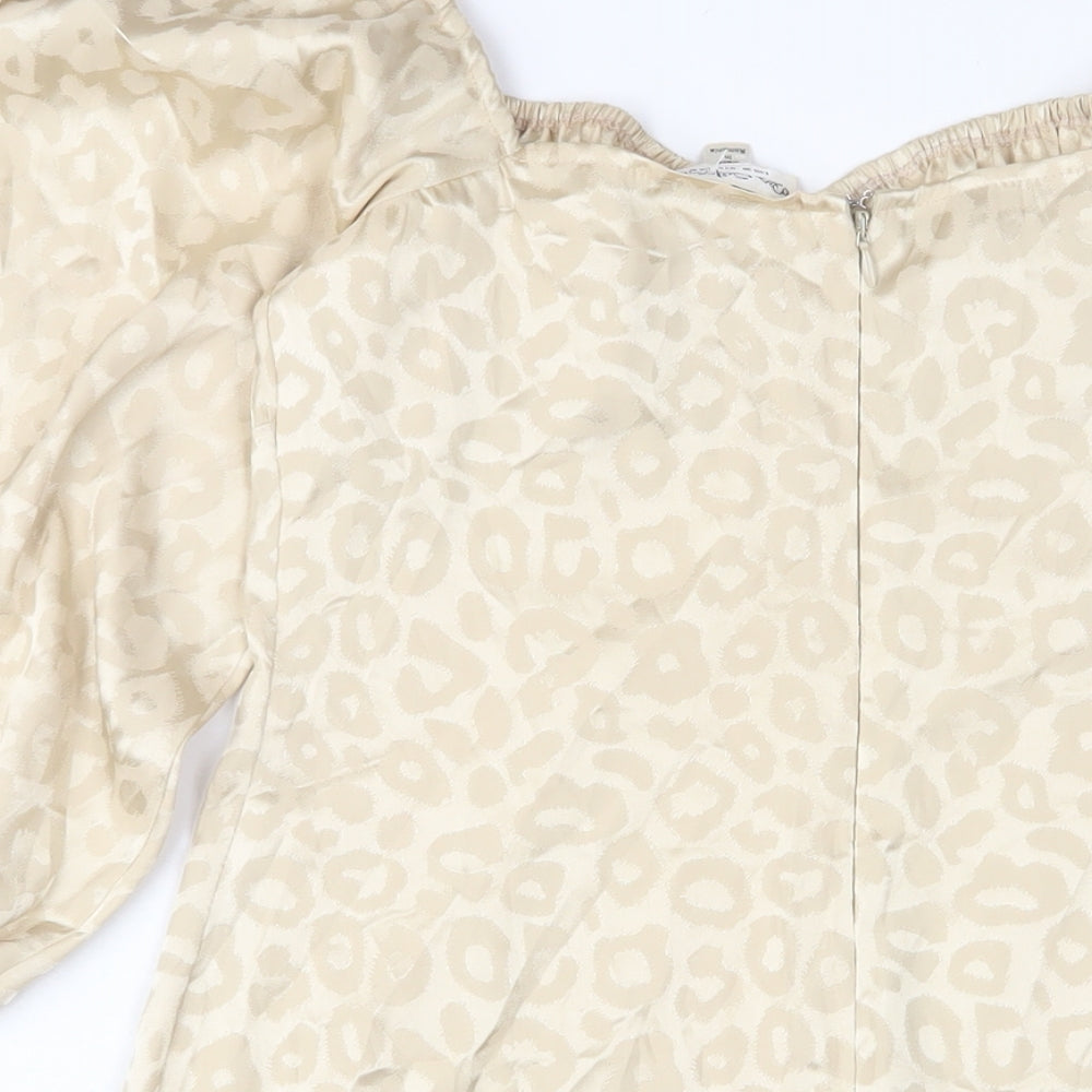 Brand and care label for Miss Selfridge women’s gold animal print polyester a-line, size UK 10, square neck button