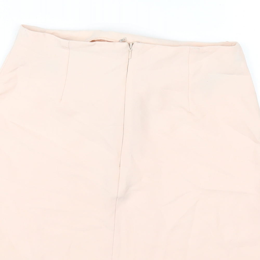 Brand and care label for Missguided women’s pink polyester a-line skirt, size UK 8, zip
