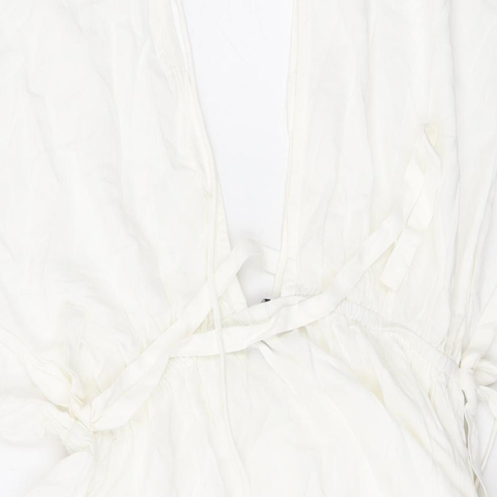 Brand and care label for ASOS women’s white viscose mini, size UK 6, v-neck pullover