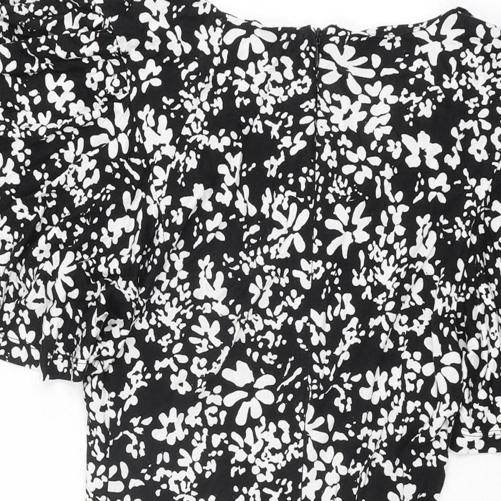 Brand and care label for French Connection women’s black floral viscose mini, size UK 8, v-neck zip