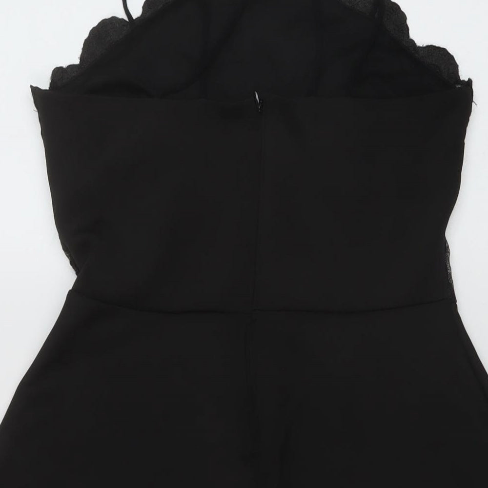 Brand and care label for Missguided women’s black polyester a-line, size UK 10, v-neck zip