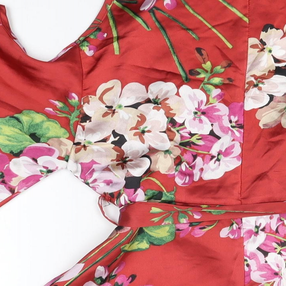 Brand and care label for Missguided women’s red floral polyester mini, size UK 8, v-neck zip