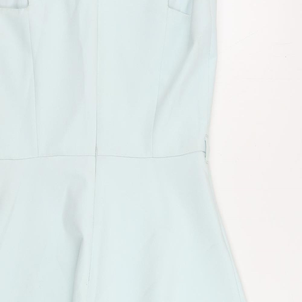 Brand and care label for Miss Selfridge women’s blue polyester skater dress, size UK 14, v-neck zip