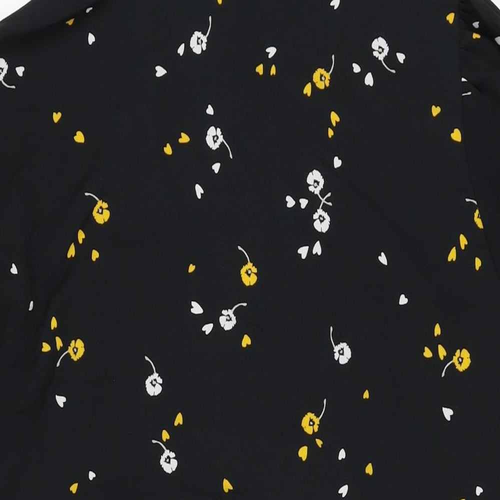 Brand and care label for ASOS women’s black floral polyester shift, size UK 18, round neck button
