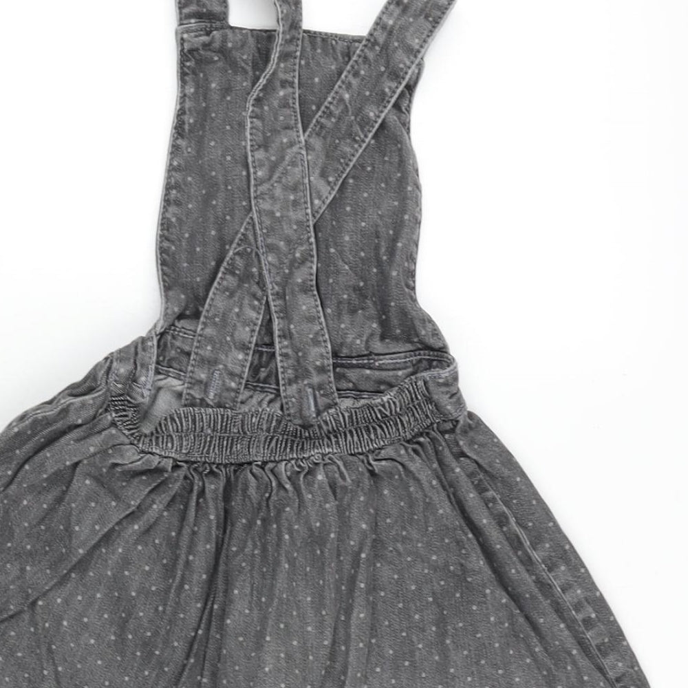 Brand and care label for Mini Club girls’ grey cotton pinafore/dungaree dress, size 18-24, months square neck