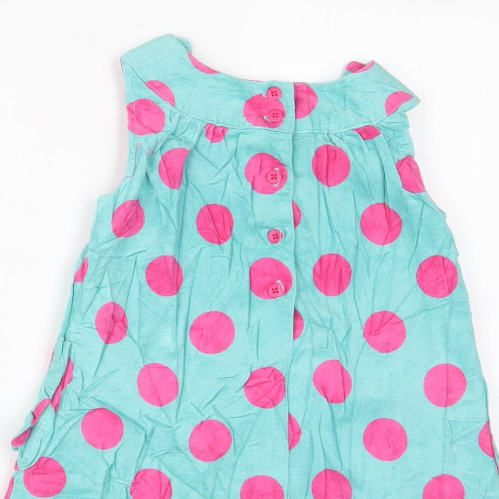 Brand and care label for John Lewis girls’ blue polka dot cotton a-line, size 18-24, months crew neck button