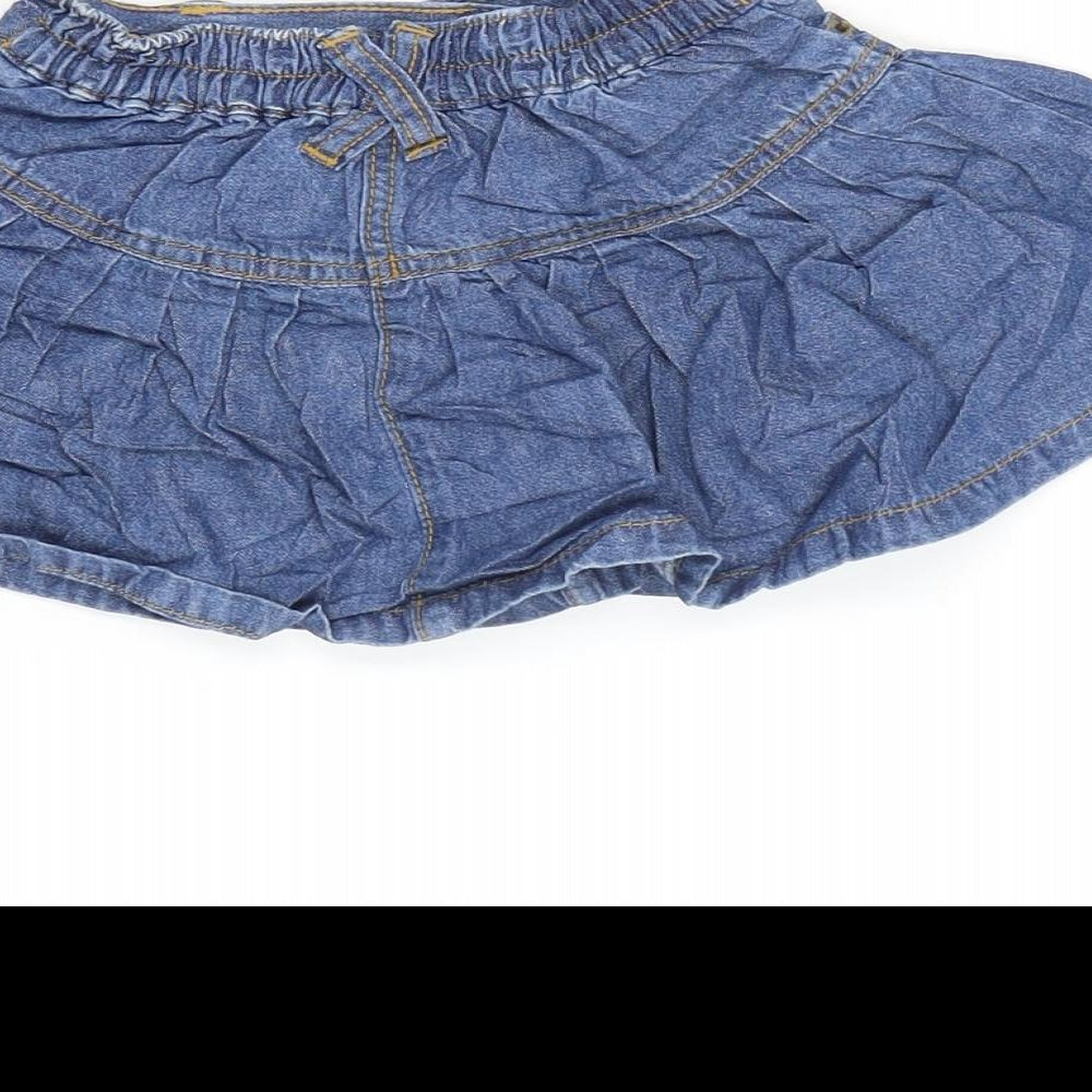 Brand and care label for George girls’ blue cotton flare skirt, size 18-24, months snap