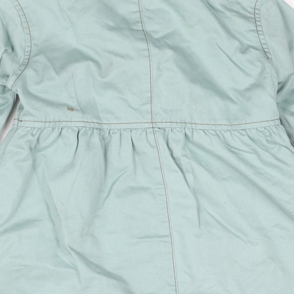 Brand and care label for Next girls’ blue jacket, size 5-6, years button