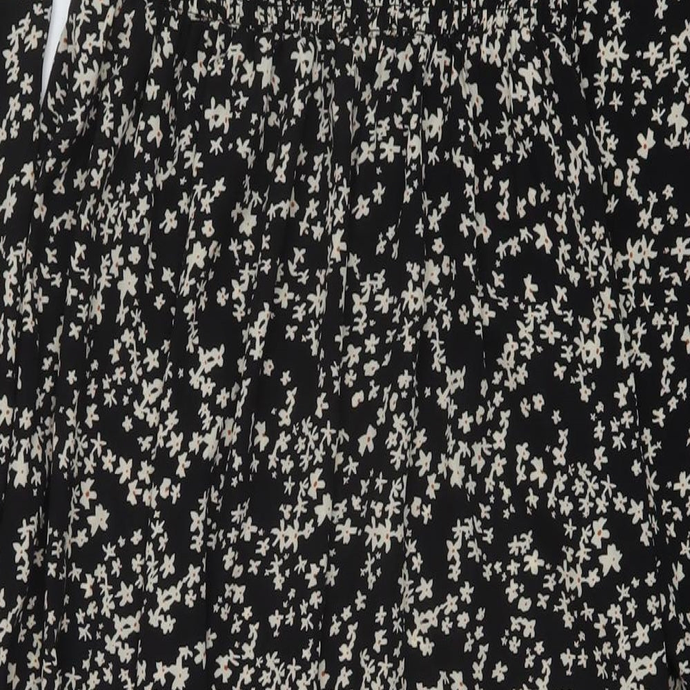 Brand and care label for Missguided women’s black floral polyester a-line, size UK 8, square neck pullover