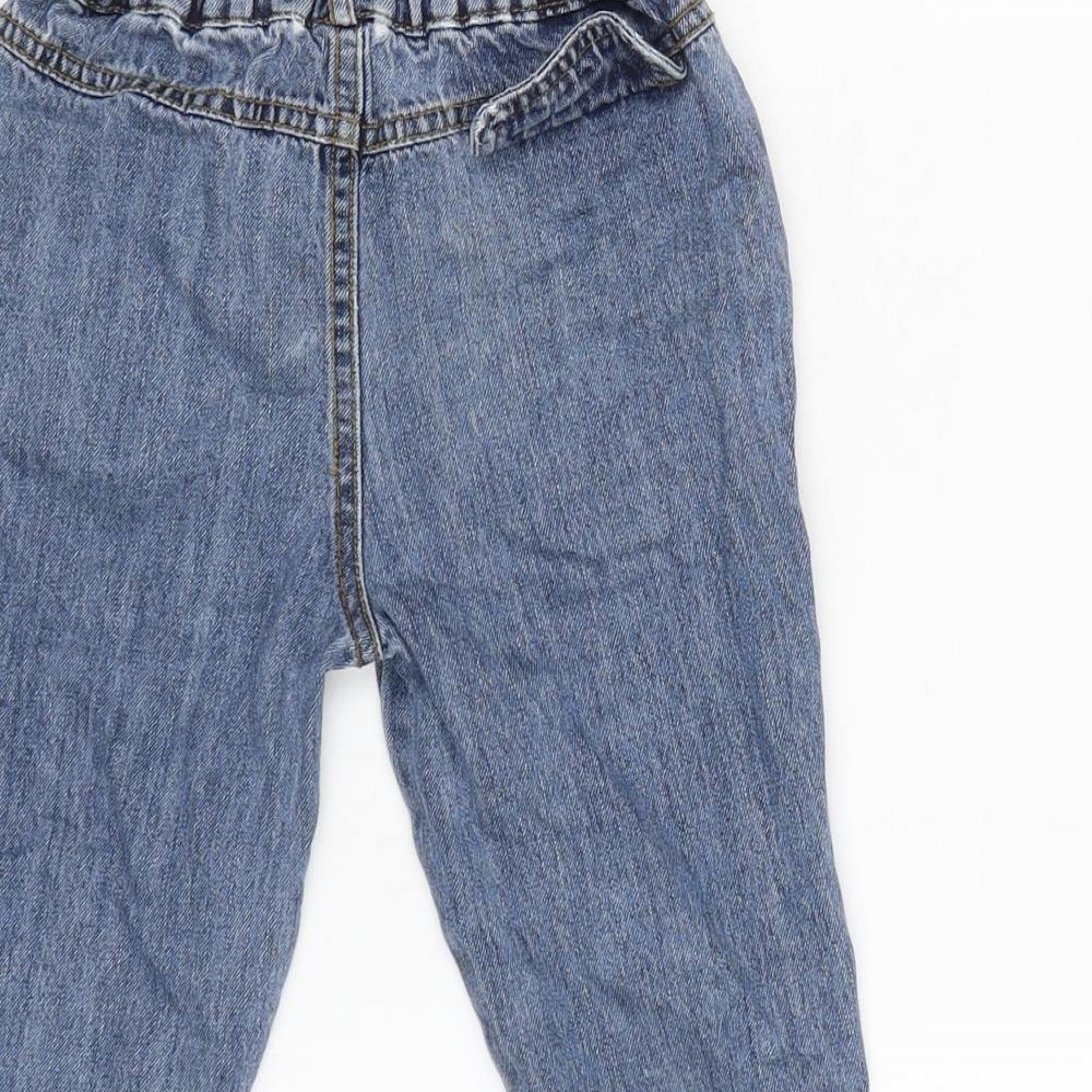 Brand and care label for Mon bebe boys’ blue cotton capri jeans, size 24, months snap - inside leg 9.5in - waist 19in.