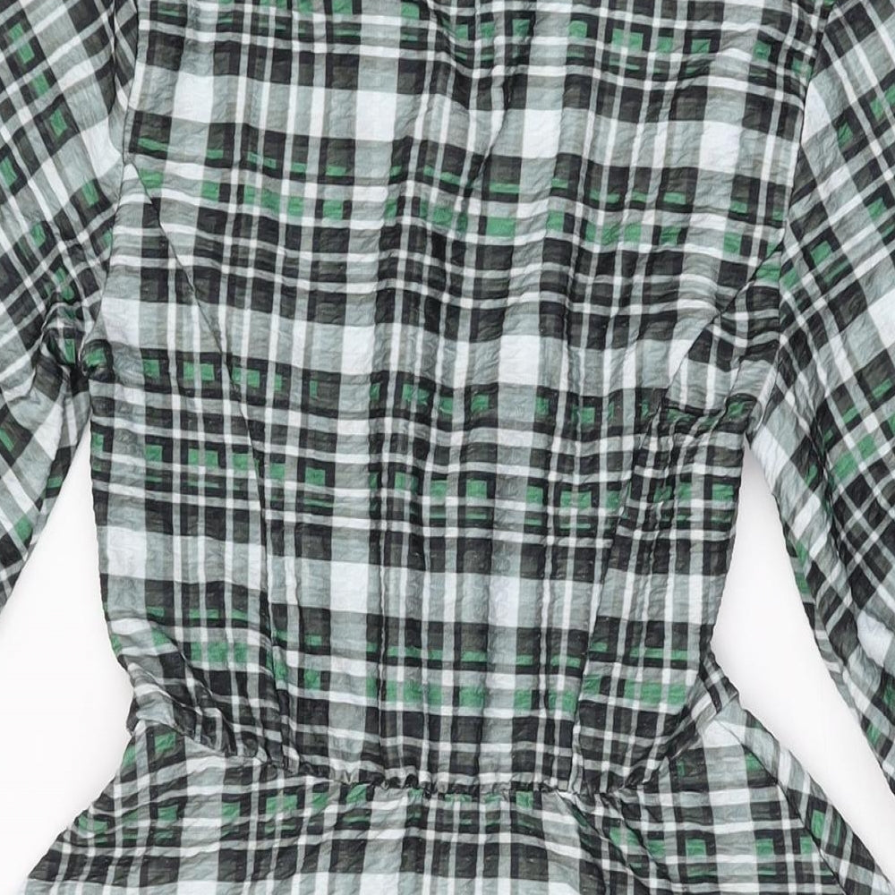 Brand and care label for ASOS women’s green geometric polyester skater dress, size UK 8, v-neck pullover
