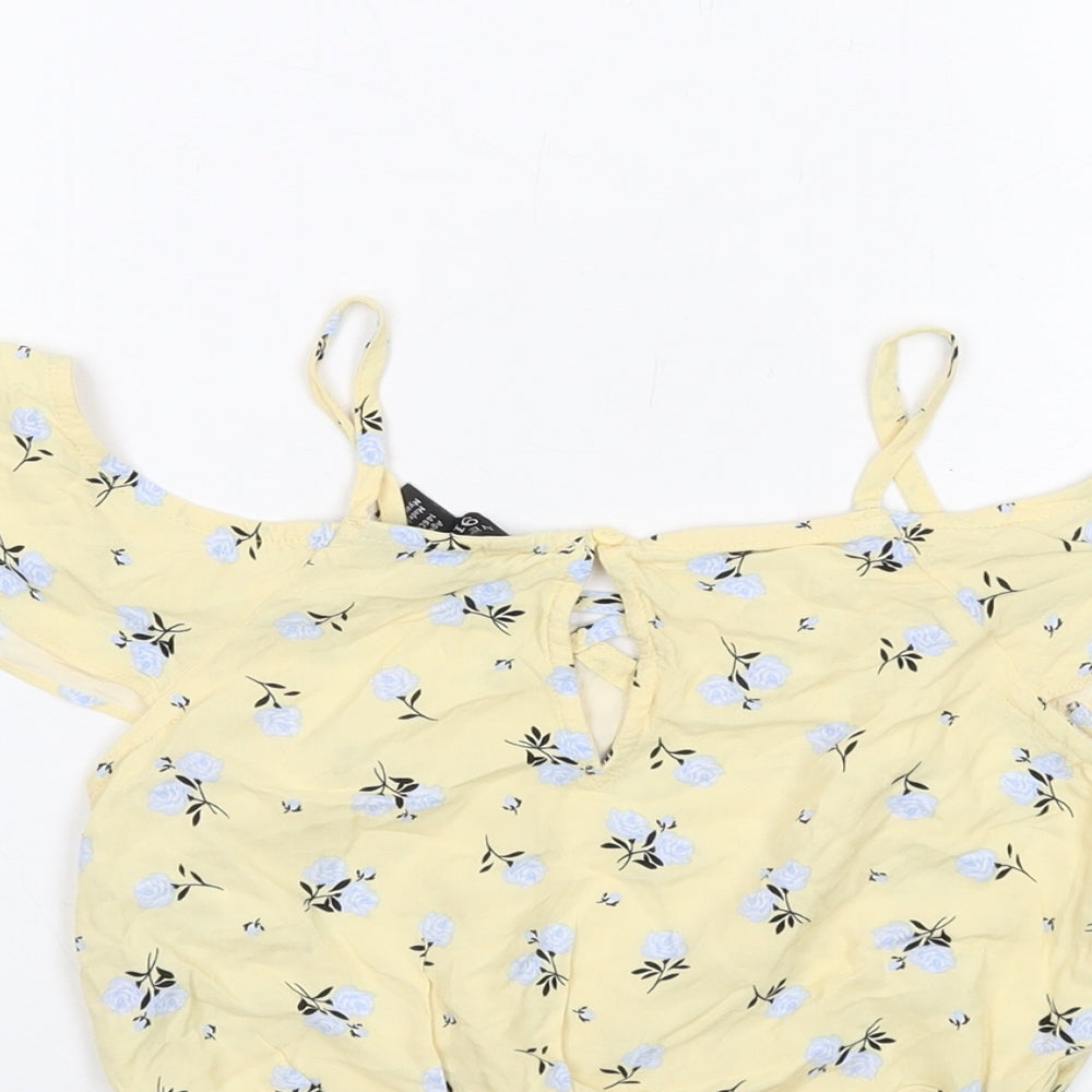 Brand and care label for New Look girls’ yellow floral viscose cropped tank, size 11, years round neck pullover