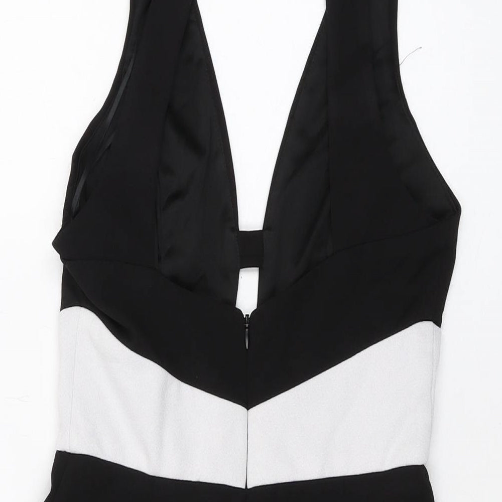 Brand and care label for Miss Selfridge women’s black polyester playsuit one-piece, size UK 8, zip