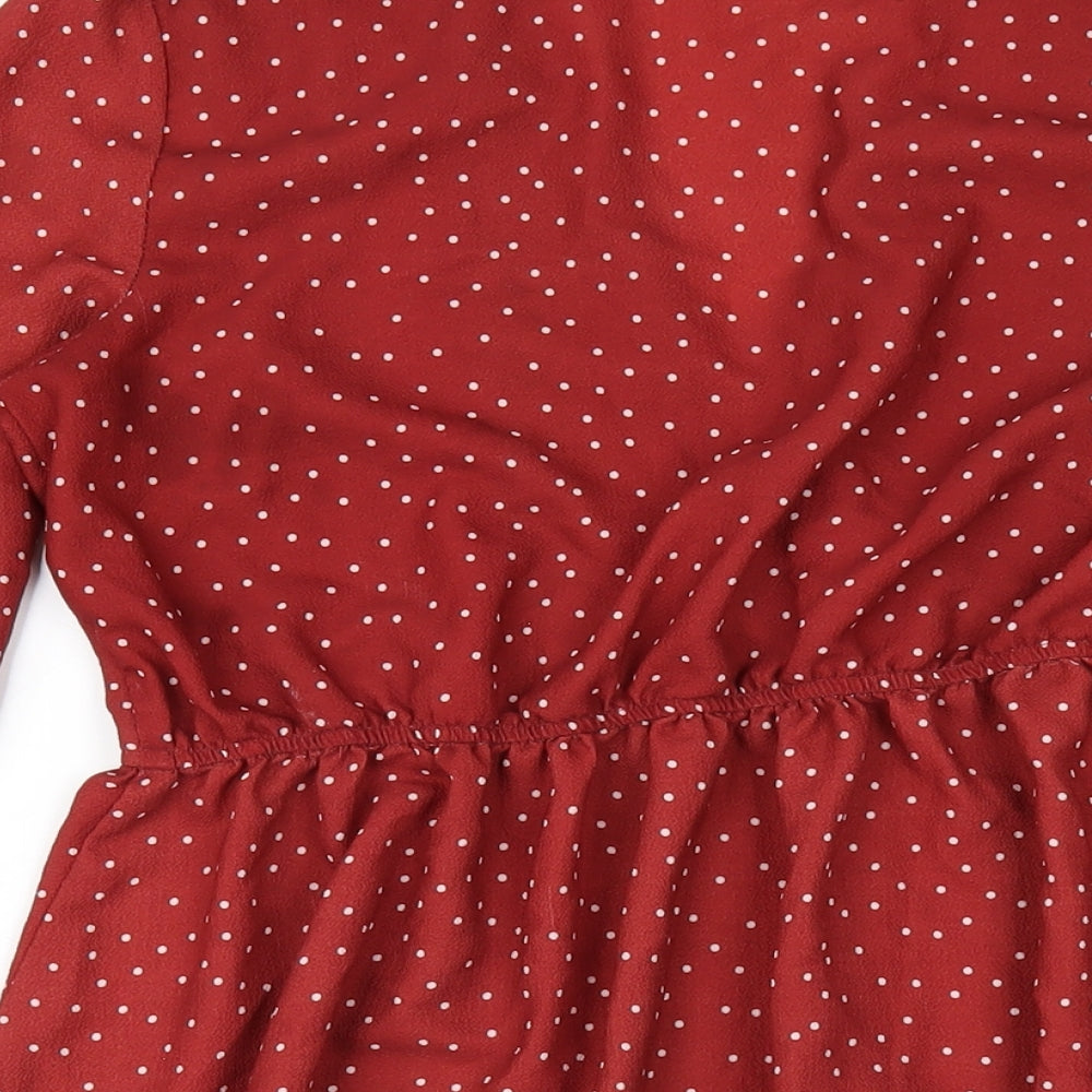 Brand and care label for In the Style women’s red polka dot polyester a-line, size UK 10, v-neck pullover