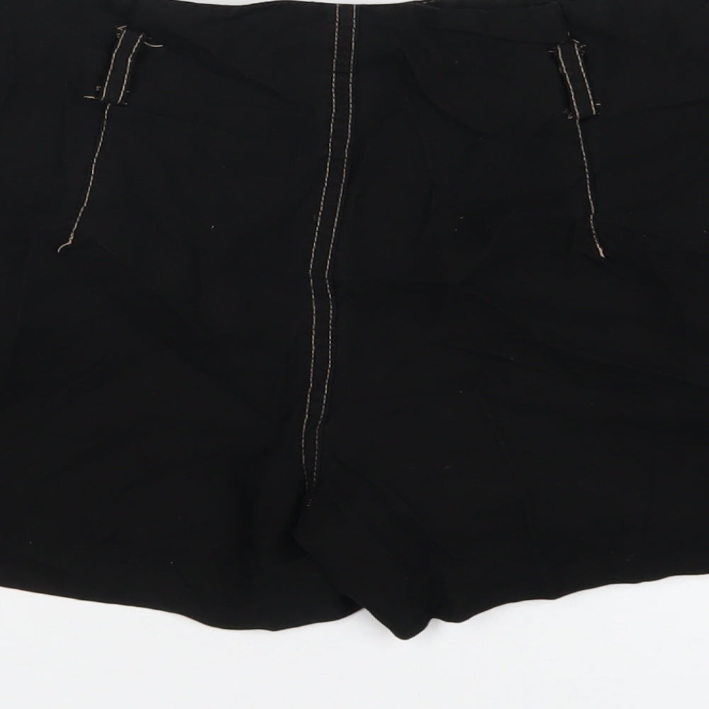 Brand and care label for Miss Selfridge women’s black vinyl basic shorts, size UK 8, regular zip