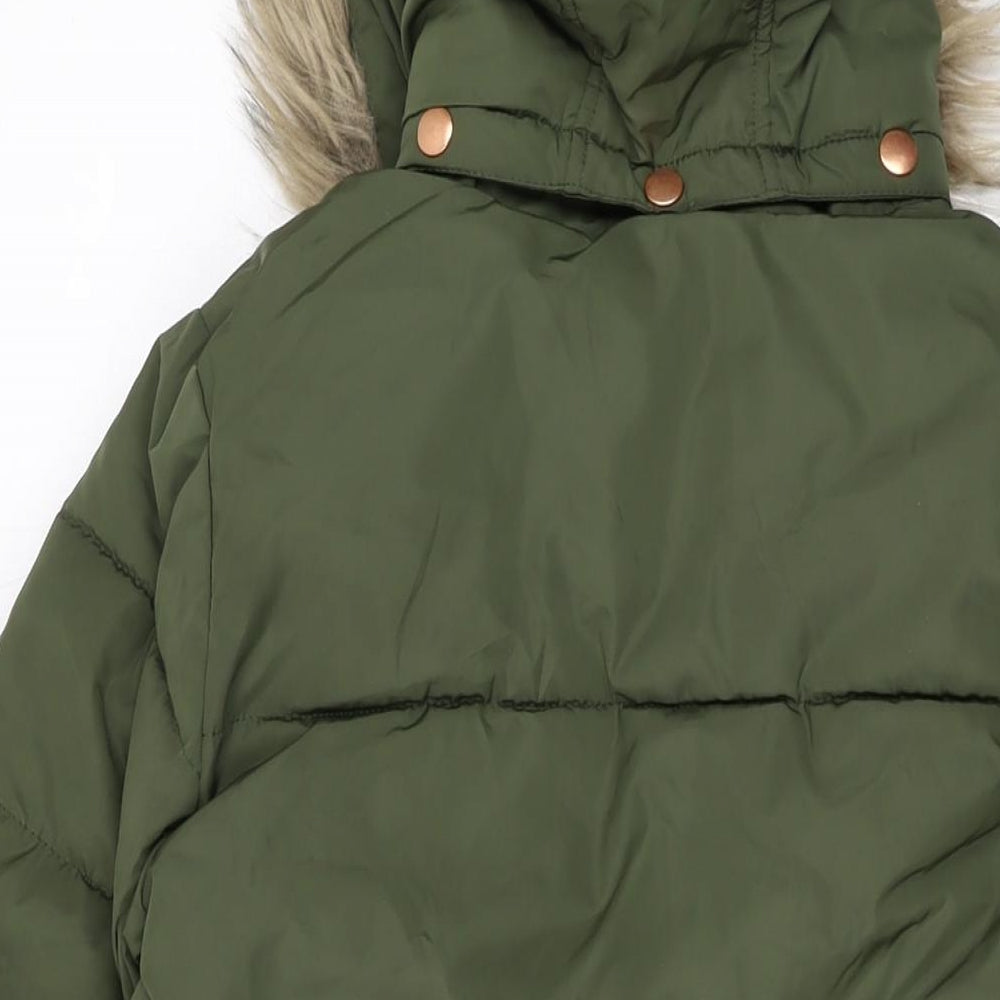 Brand and care label for John Lewis girls’ green parka jacket, size 11, years zip