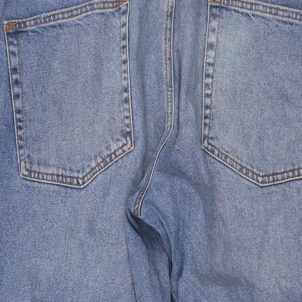 Brand and care label for ASOS women’s blue cotton mom jeans, size UK 34, in, 25-inch leg regular button