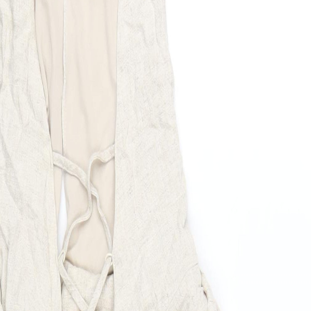 Brand and care label for ASOS women’s beige viscose mini, size UK 10, halter zip