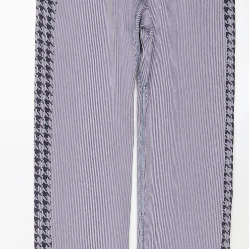 Brand and care label for ASOS women’s purple polyamide capri leggings, size M, 20-inch leg