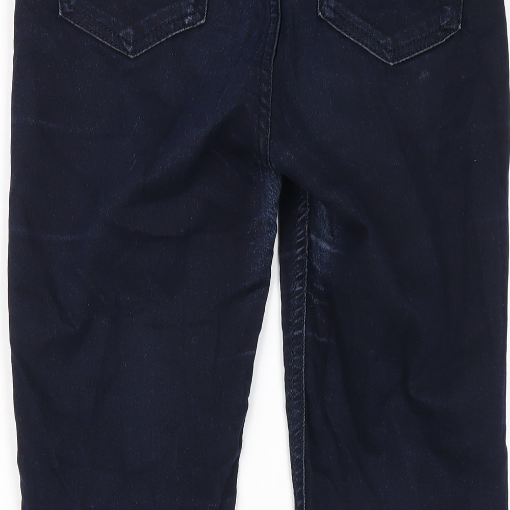 Brand and care label for Dunnes women’s blue cotton skinny jeans, size UK 8, 28-inch leg regular zip