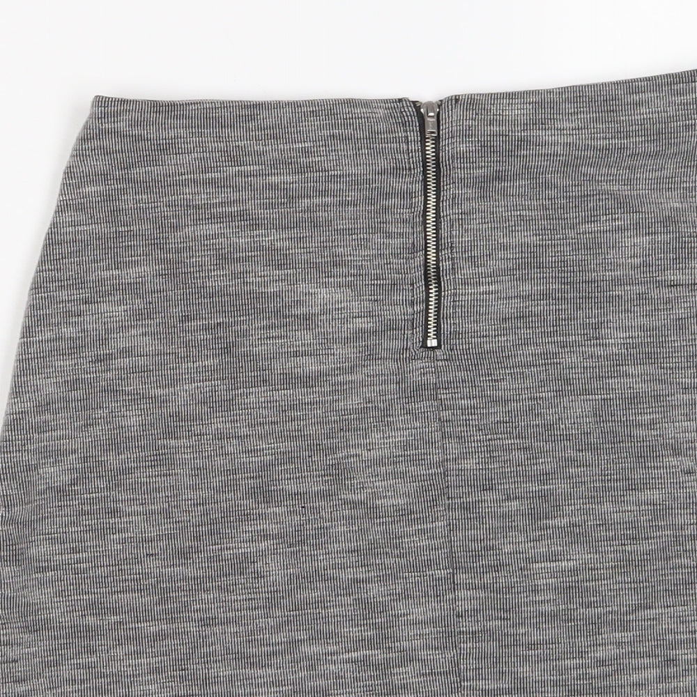 Brand and care label for Miss Selfridge women’s grey polyester a-line skirt, size UK 10, zip