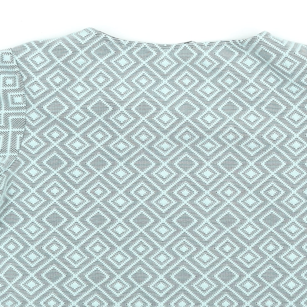 Brand and care label for New Look girls’ blue geometric polyester basic blouse, size 12-13, years round neck pullover