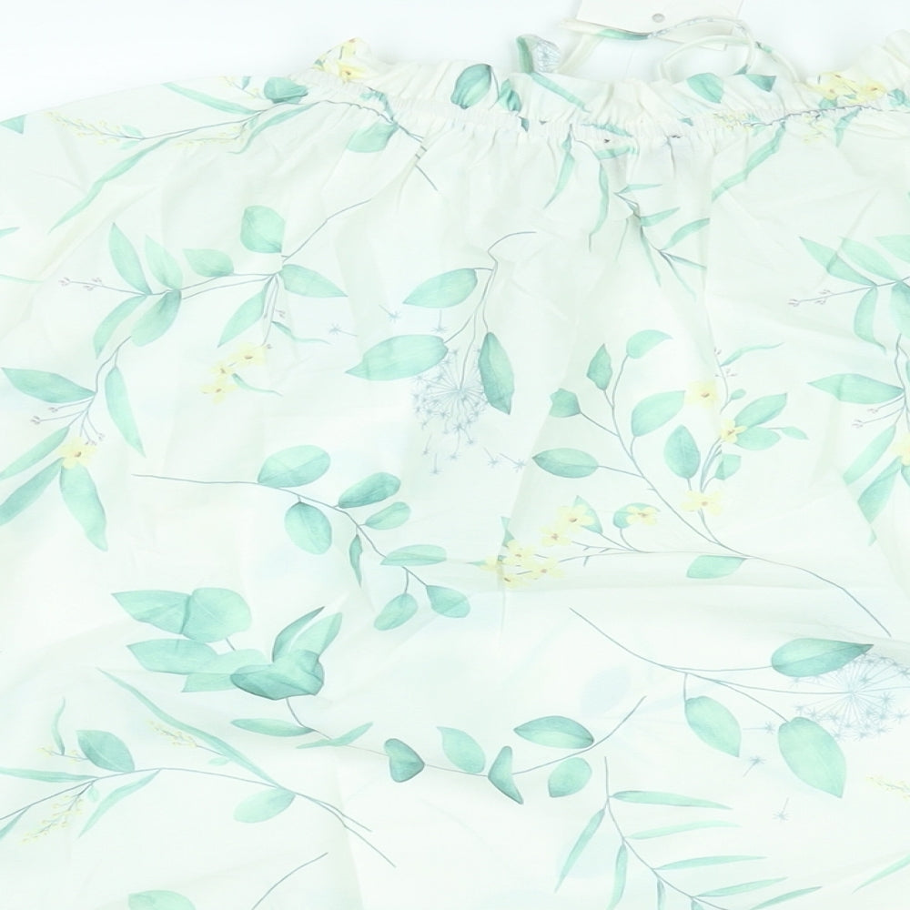 Brand and care label for In the Style women’s white floral polyester basic blouse, size UK 14, mock neck
