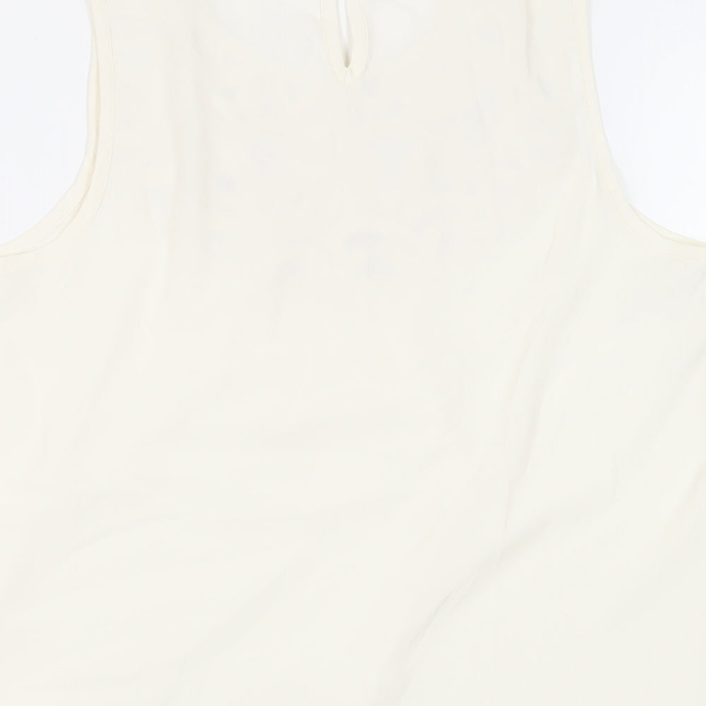 Brand and care label for Miss Selfridge women’s ivory polyester basic blouse, size UK 10, round neck - neckline detail