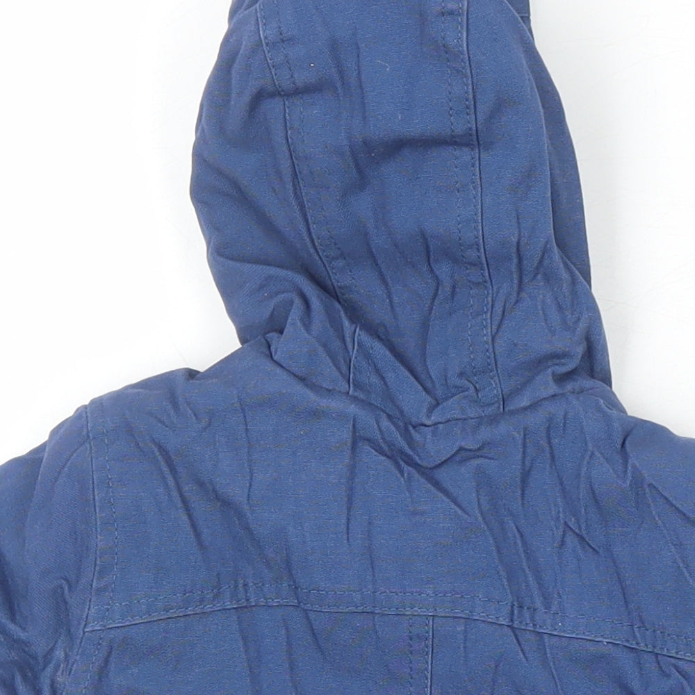 Brand and care label for Mothercare boys’ blue jacket coat, size 3-6, months