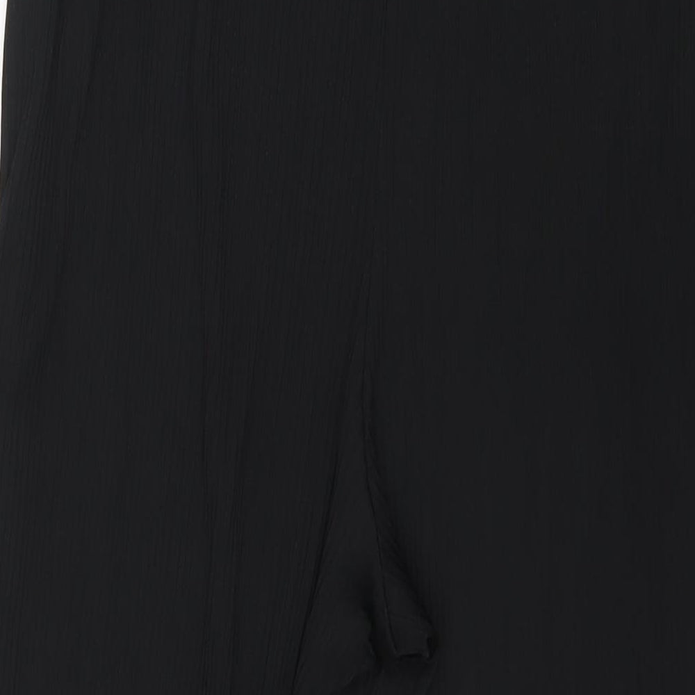 Brand and care label for ASOS women’s black polyester trousers, size UK 16, 21-inch leg regular
