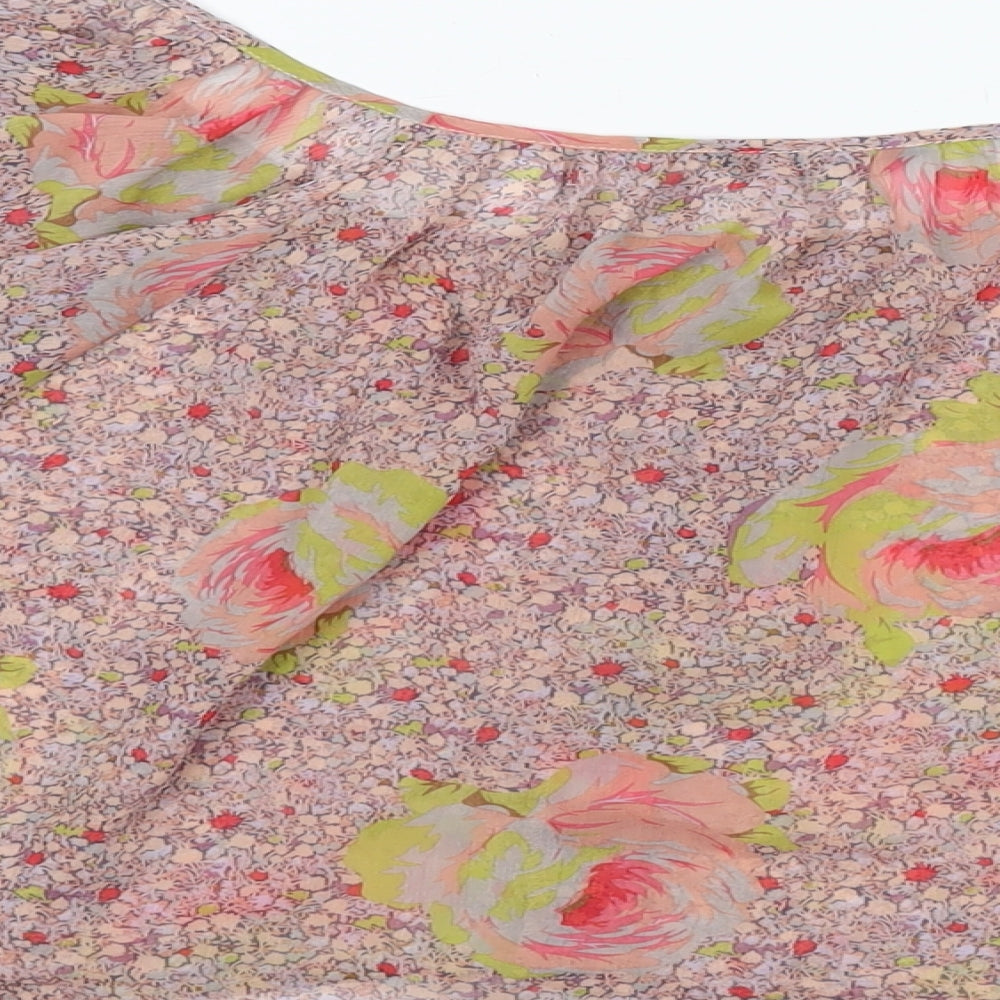 Brand and care label for Miss Selfridge women’s pink floral polyester basic blouse, size UK 12, round neck