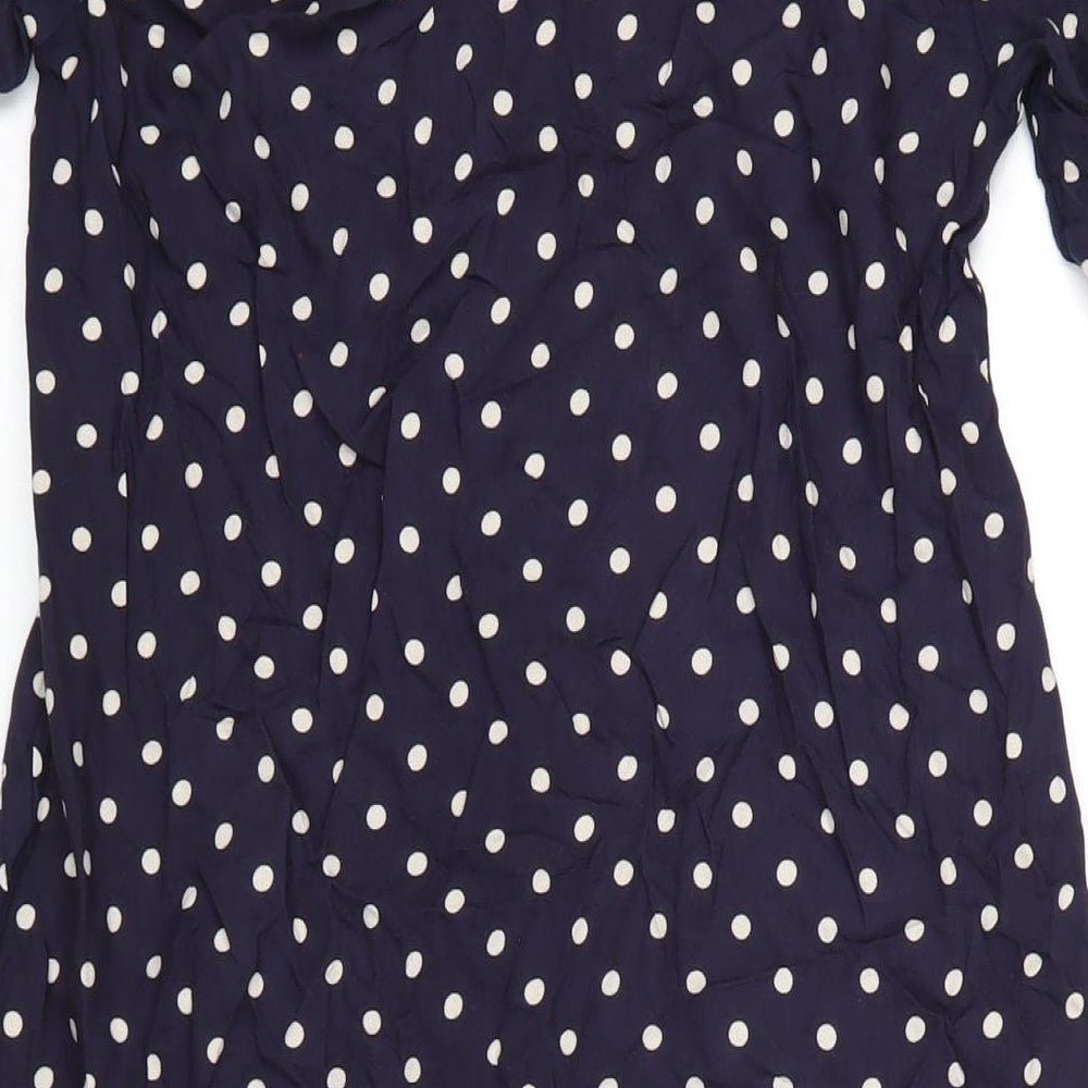 Brand and care label for ASOS women’s blue polka dot viscose a-line, size UK 8, v-neck button