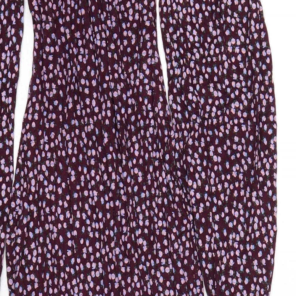 Brand and care label for Missguided women’s purple floral viscose bodycon, size UK 4, square neck pullover