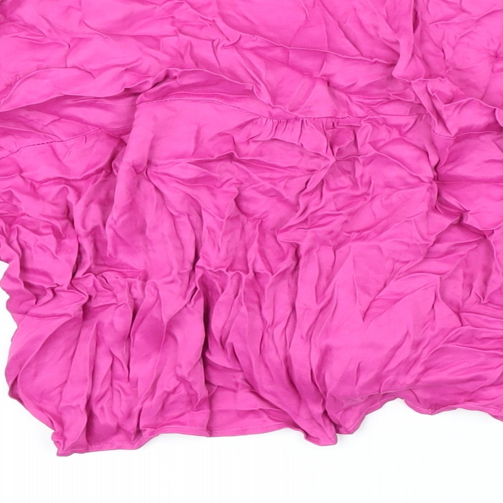 Brand and care label for Berksha women’s pink viscose cropped blouse, size L, collared