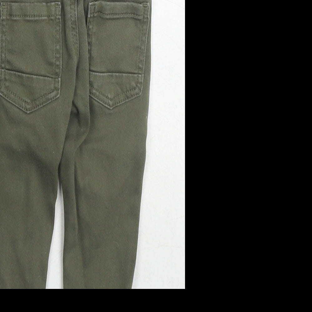 Brand and care label for Denim & Co. boys’ green cotton jogger jeans, size 9-12, months drawstring