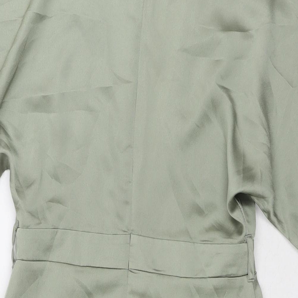 Brand and care label for Missguided women’s green polyester a-line, size UK 14, v-neck zip