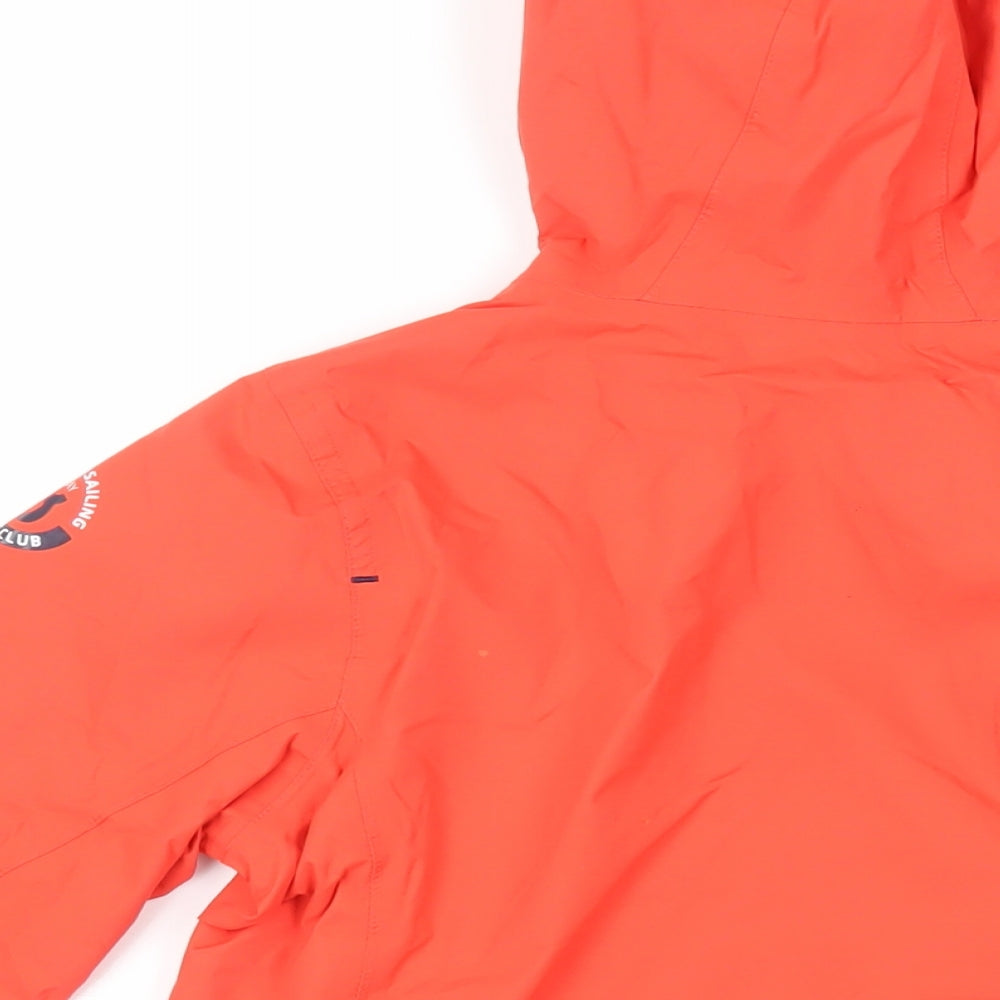 Brand and care label for Decathlon boys’ red windbreaker jacket, size 10, years - hooded zipped pockets