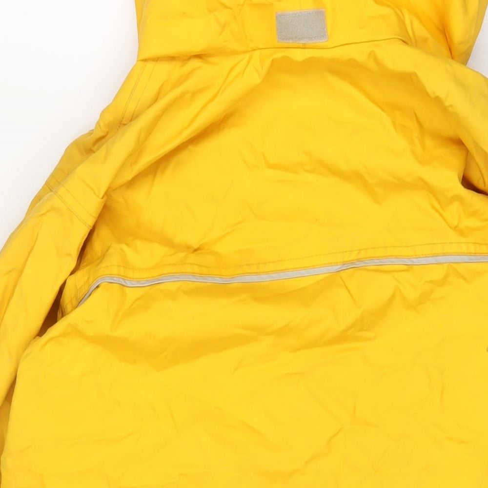 Brand and care label for Tribord boys’ yellow jacket, size 12, years zip