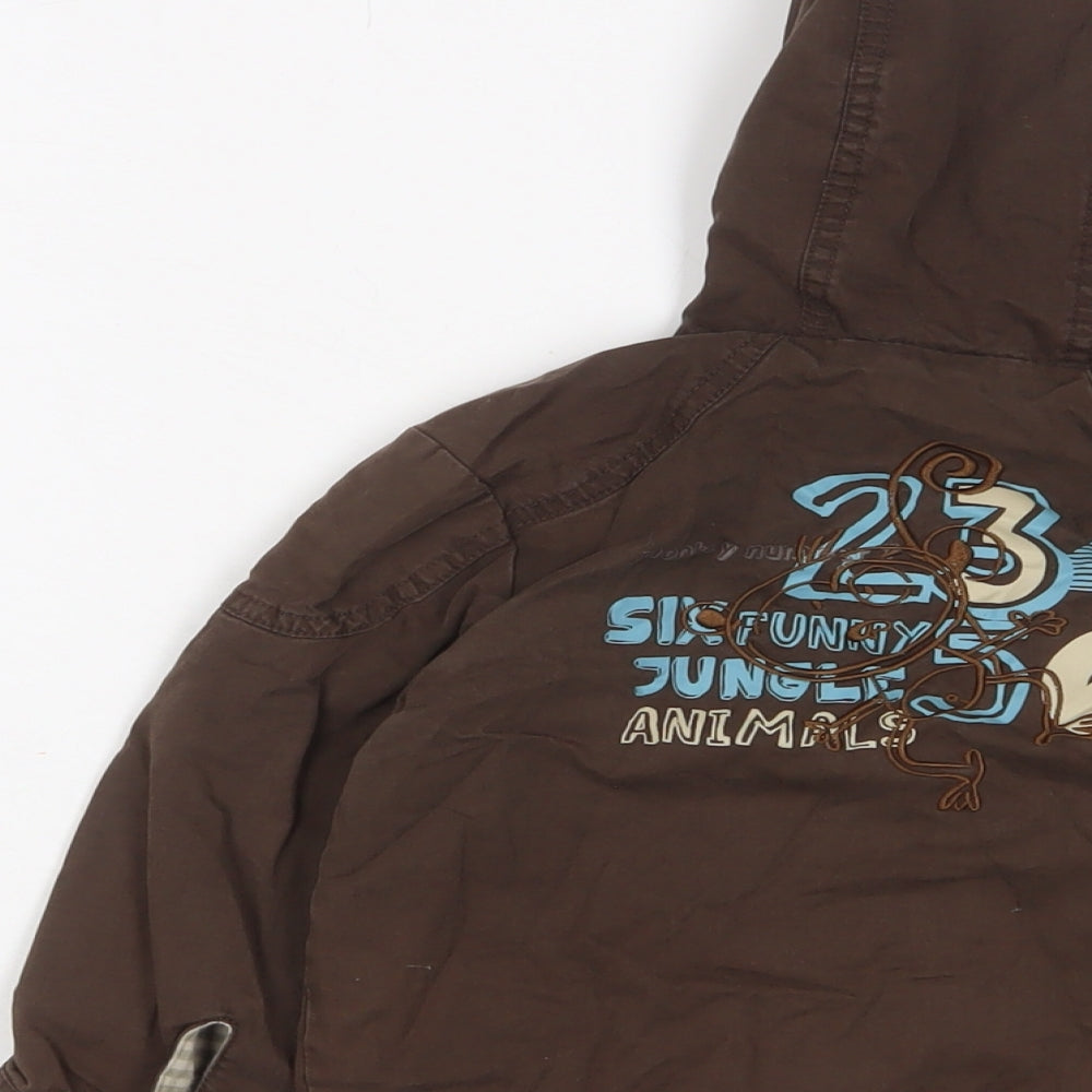 Brand and care label for Gorilla boys’ brown jacket, size 18-24, months zip