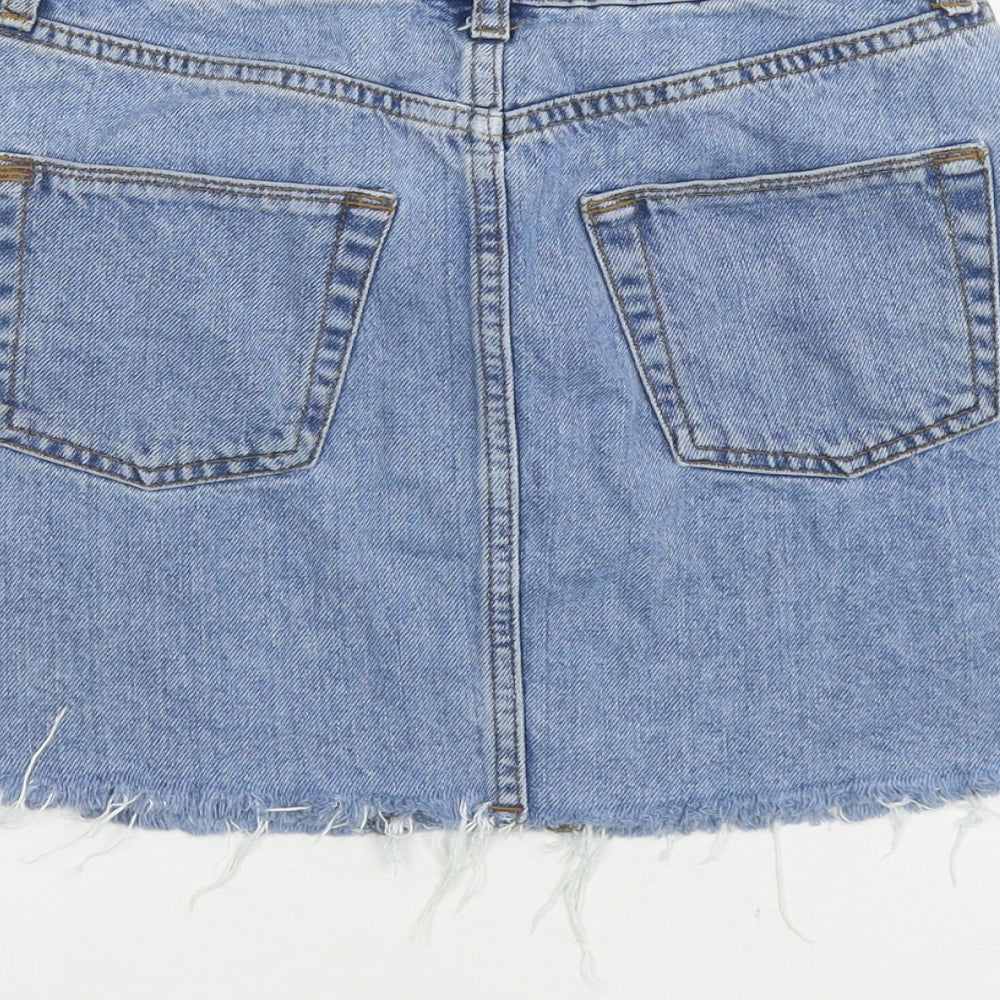 Brand and care label for BDG women’s blue cotton mini skirt, size XS, button