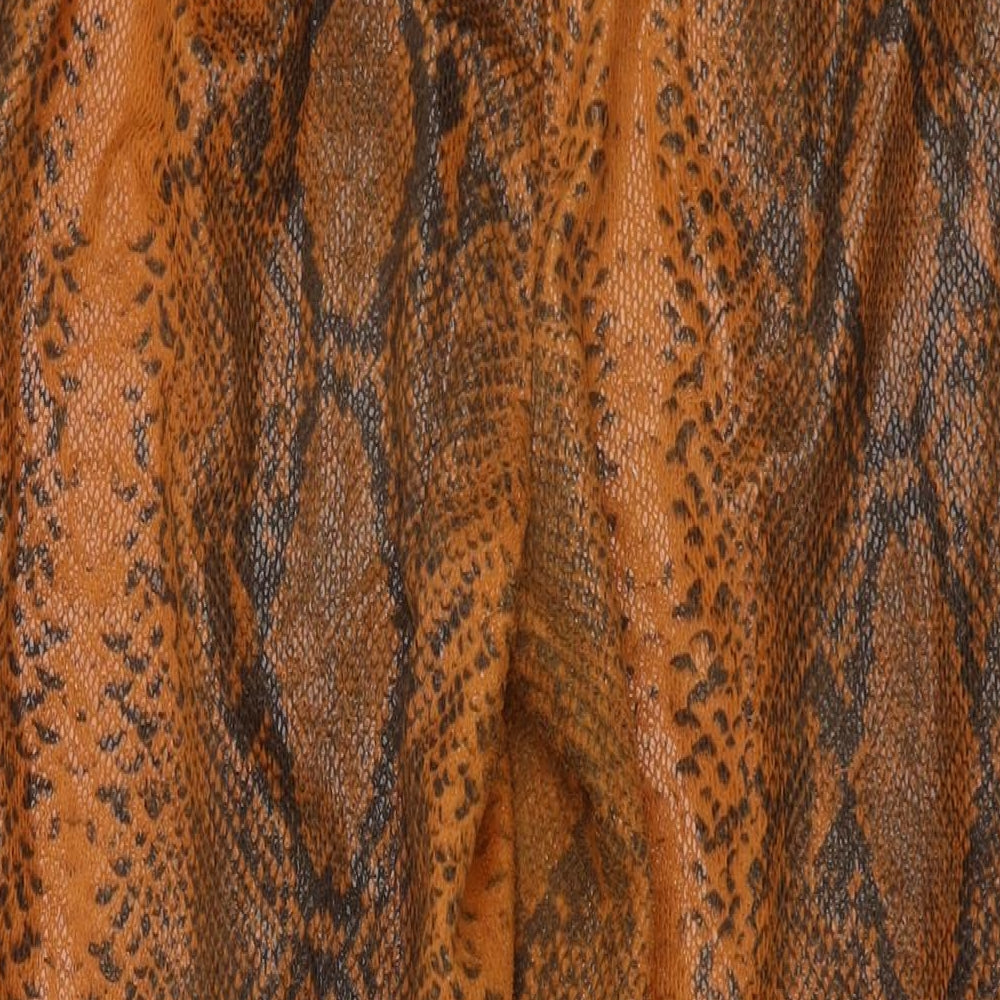 Brand and care label for Missguided women’s orange animal print polyurethane trousers, size UK 12, 28-inch leg regular zip